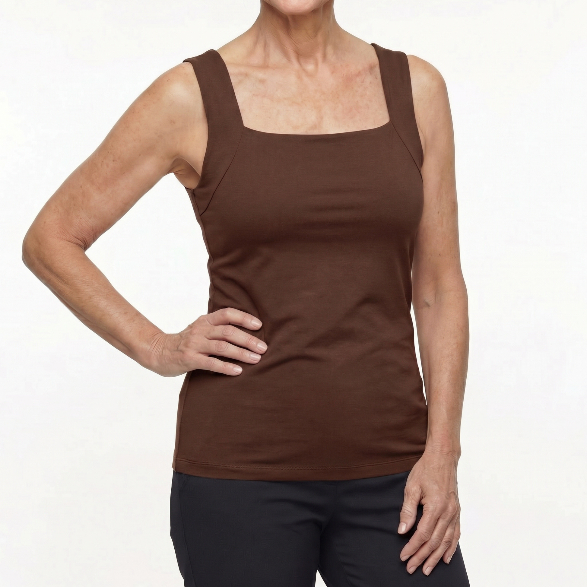 Woman wearing a brown tank top on a white background