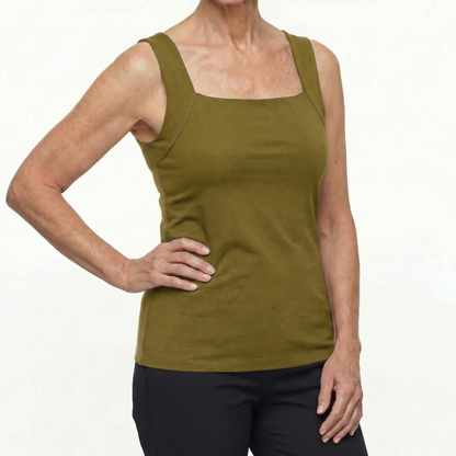 Person wearing a green tank top on a white background